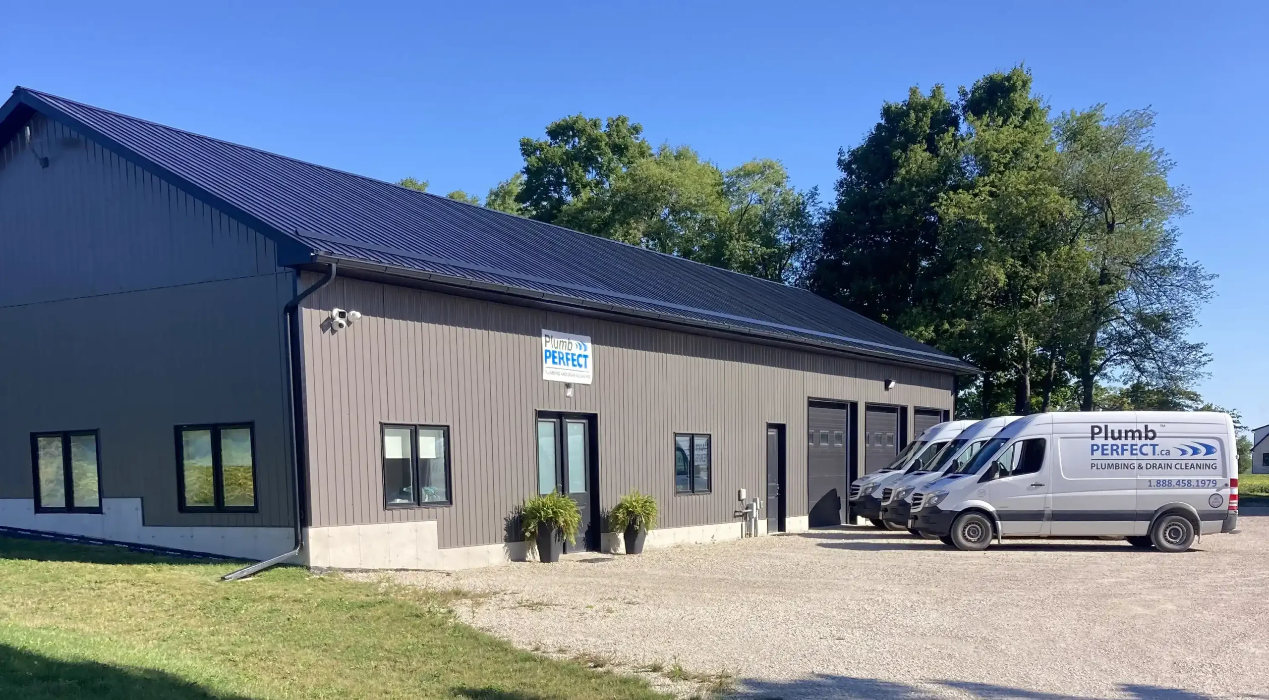 About-Plumb-Perfect-Office-with-cars-parked-in-front