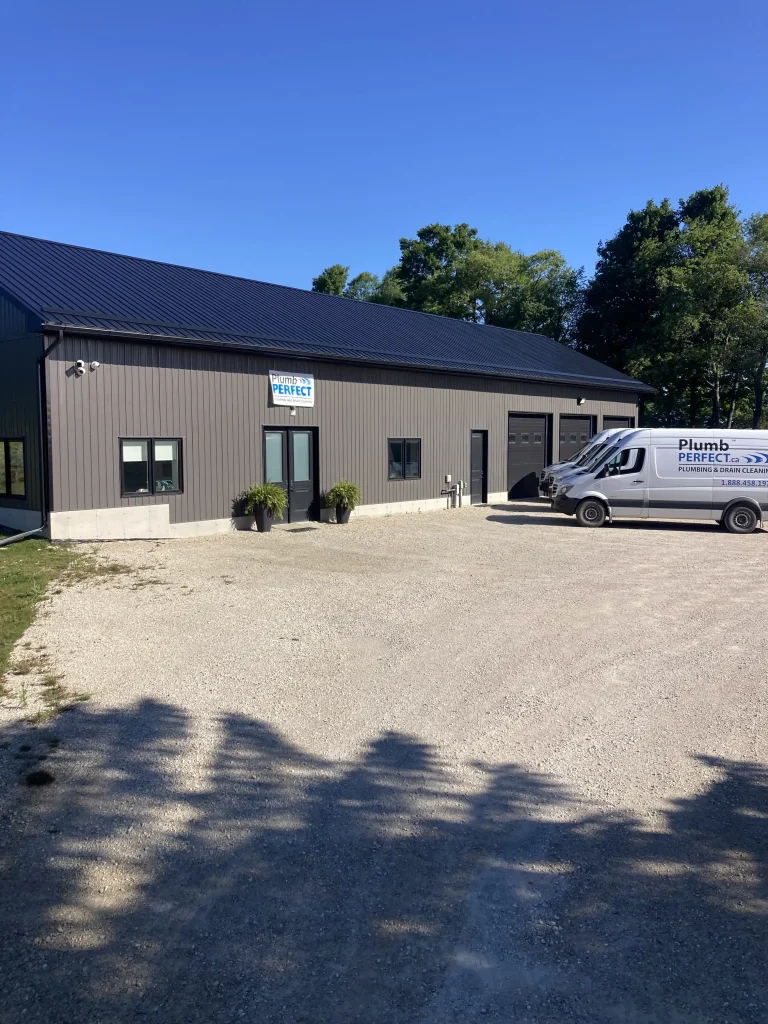 Plumb Perfect Office parked in front v2