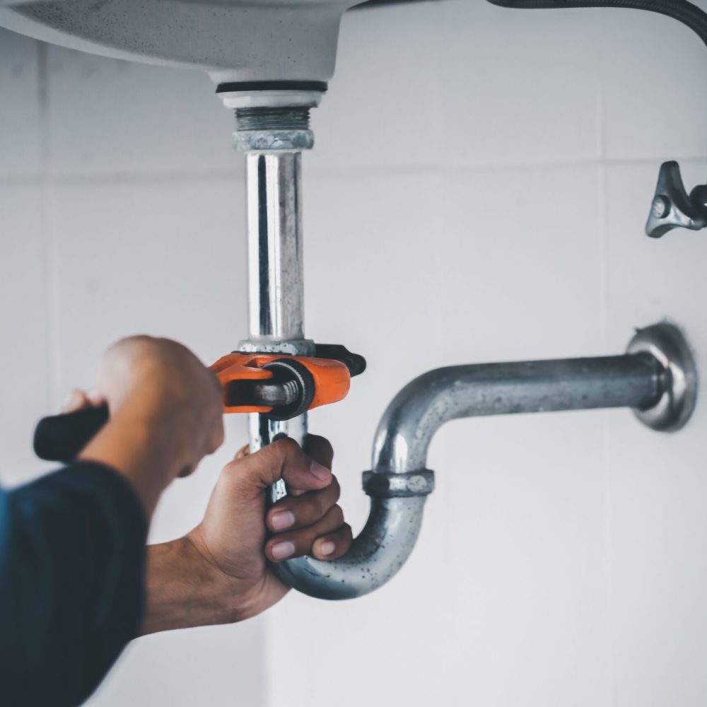 Plumber,At,Work,In,A,Bathroom,,Plumbing,Repair,Service,,Assemble